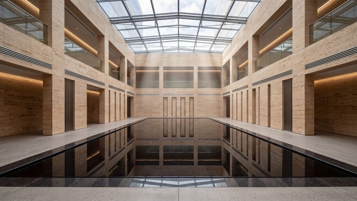 A flawless black reflecting pool in a premium architectural space, symbolizing active listening.