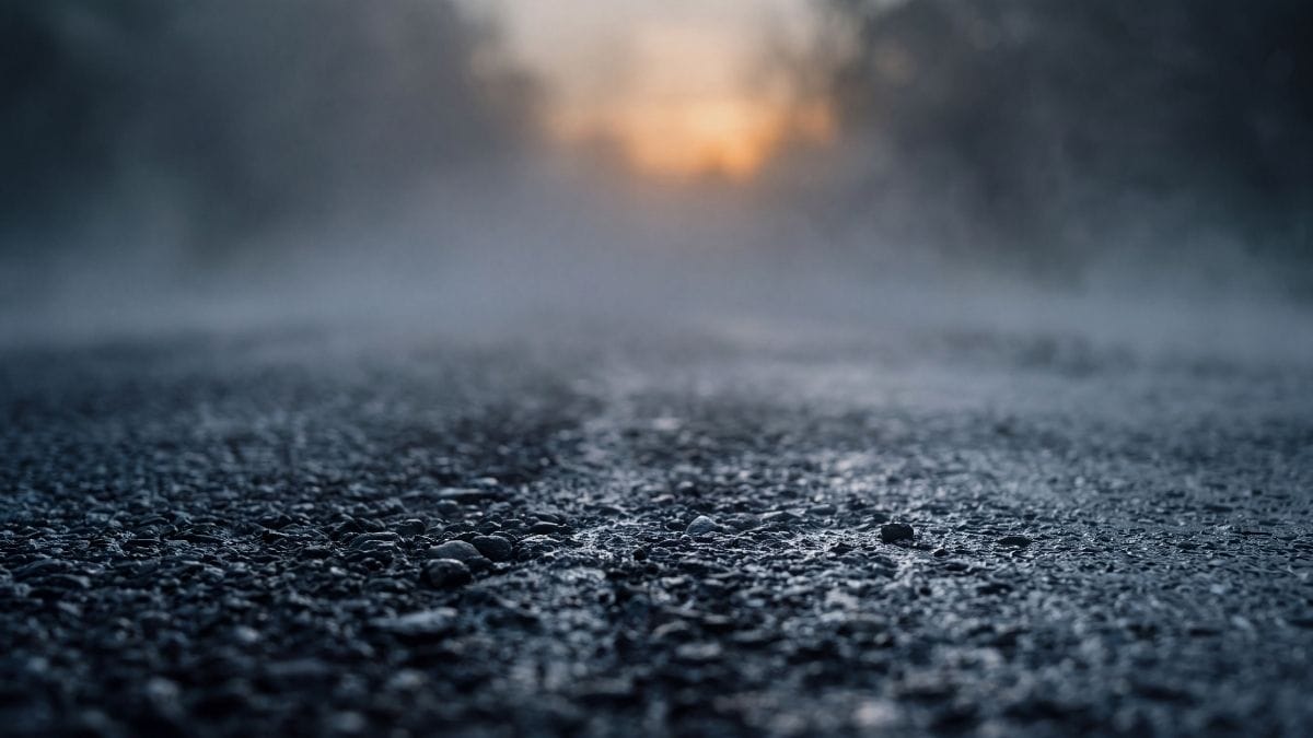 Abstract representation of morning mist over dark tarmac, symbolising sleep inertia and brain fog.