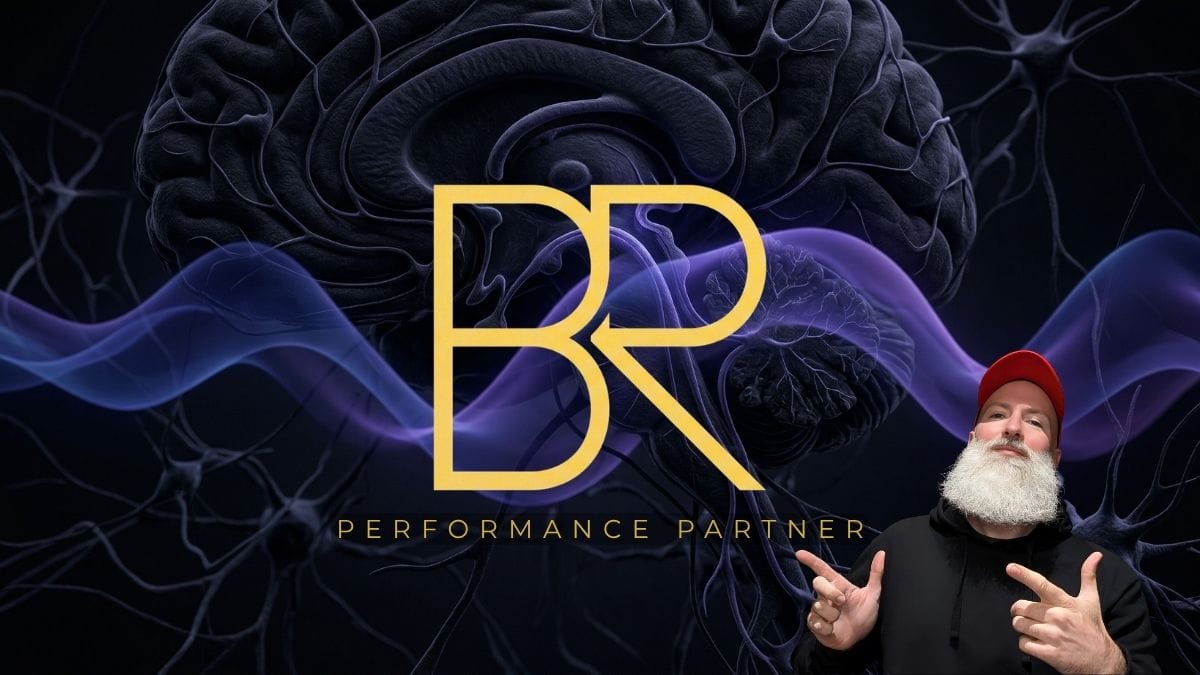 hil Jesse, the Performance Partner for Organisations, pointing at his branding for corporate executive performance.