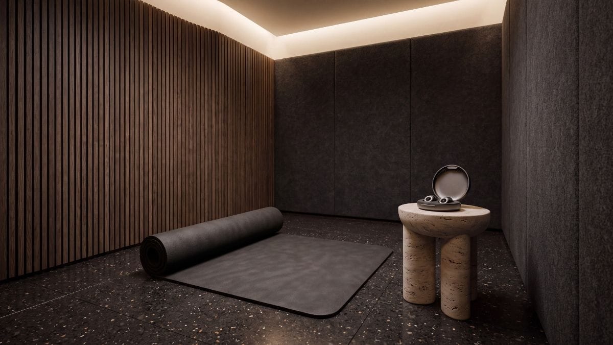 Fluted acoustic oak sanctuary with high-density rest mat and quiet sensory tools bathed in warm ambient light.