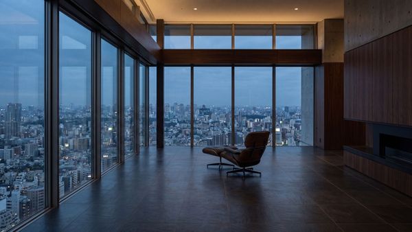 A minimalist luxury penthouse overlooking a vast city at dusk, representing quiet resilience and solitude.