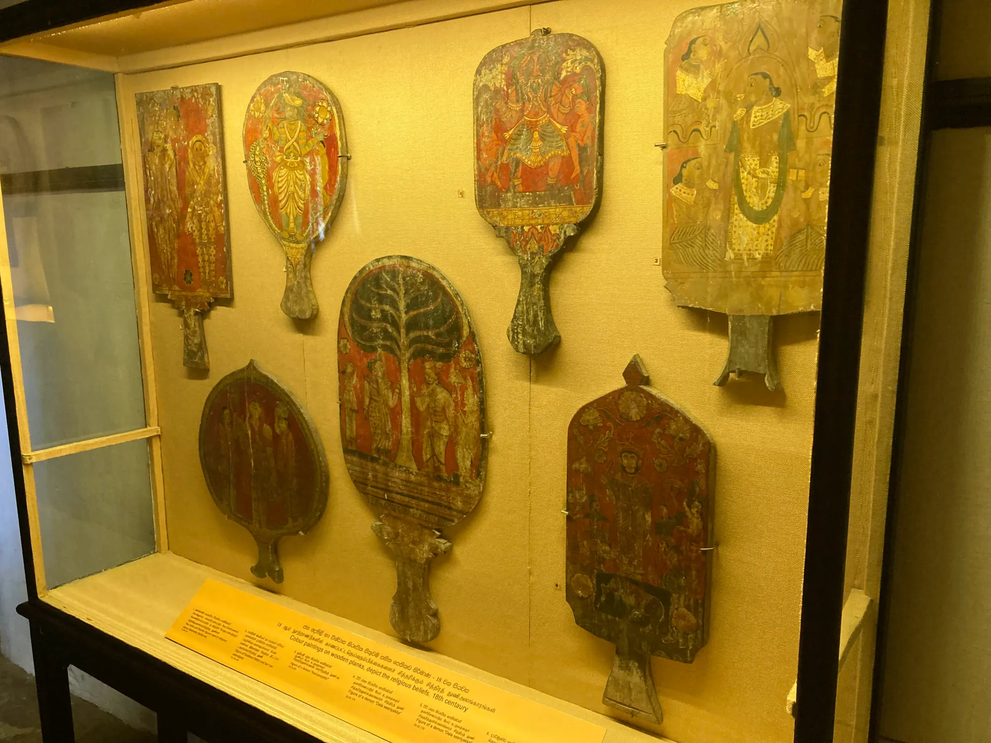 Wooden planks with paintings showcased at the Kandy National Museum, Sri Lanka