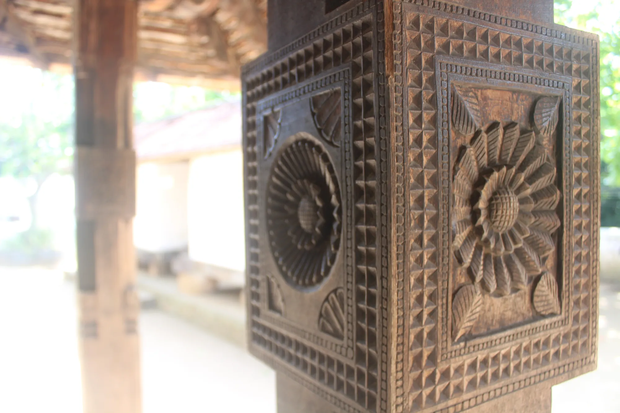 Wooden carvings of flowers at Embekka Devalaya, Sri Lanka