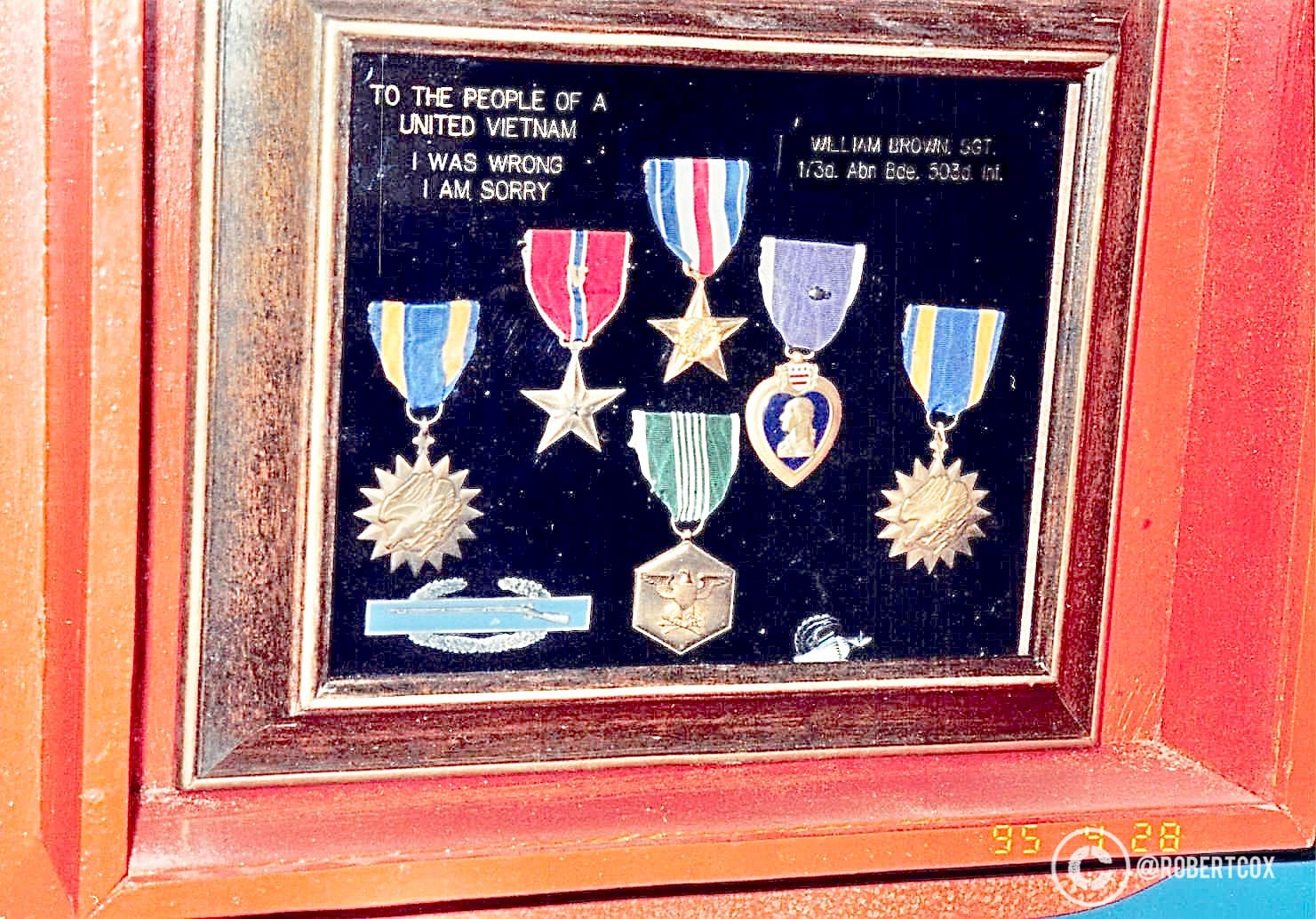A framed exhibit at the War Remnants Museum contains military medals and ribbons donated by William Brown, a U.S. Army Sergeant from the 1st/30th Artillery, 502nd Infantry. The text reads: "To the People of a United Vietnam, I Was Wrong, I Am Sorry." The medals include a Purple Heart, Bronze Star, and others, symbolizing Brown's regret for his role in the Vietnam War. This display is a notable part of the museum's collection, reflecting a personal apology from an American soldier to the Vietnamese people, aligning with the museum's focus on the war's impact and reconciliation efforts.