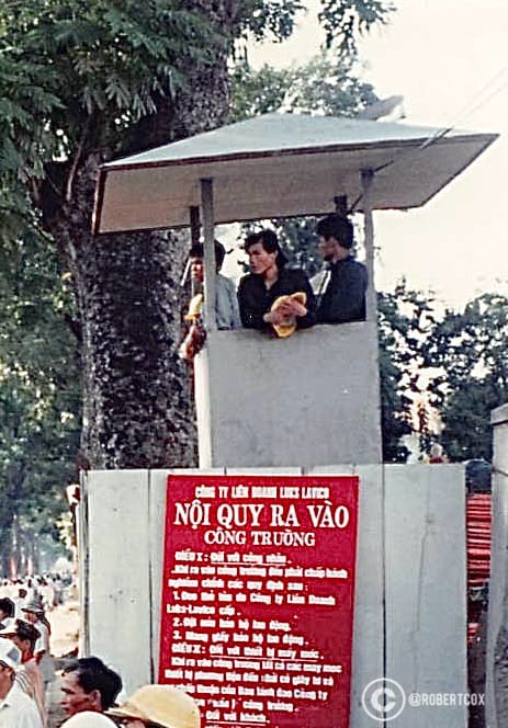 A small observation post near the parade staging area or “working area”, the sign says, “NOTICE FOR PEOPLE ENTERING THE WORKING AREA: To ensure safety and order during the event, the Organizing Committee requests: (1) Do not bring weapons or explosives into the area; (2) Strictly follow the instructions and guidance of the Organizing Committee. NOTICE: Anyone violating the above regulations will be asked to leave the working area immediately by the Organizing Committee.” (April 30, 1995)
