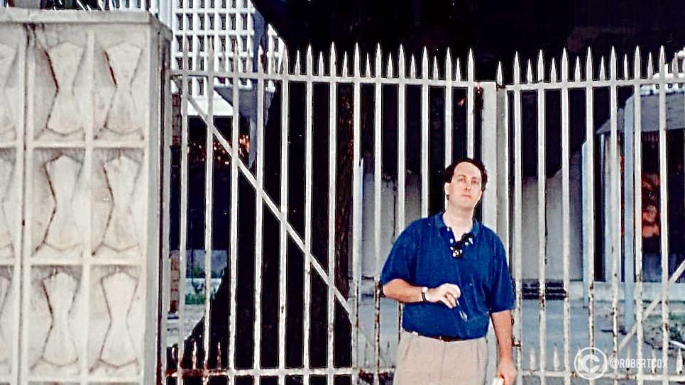 I made it a point to stand at this historically significant gate, the entry point breached by the Viet Cong's Nghia Phong unit during the Tet Offensive on January 31, 1968. The embassy compound, located near Le Duan Street in District 1, was a focal point of the Vietnam War, and this gate was part of the perimeter the Viet Cong attacked. The embassy building itself was still standing in 1995 but was demolished later in the decade. (April 29, 1995)