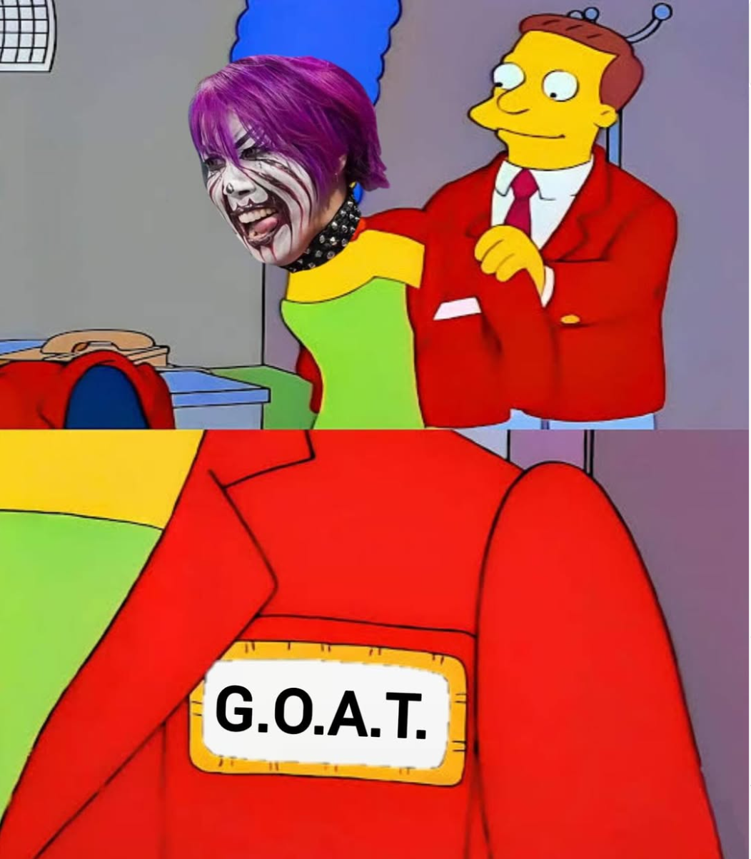 screenshot of a meme featuring a photoshopped image of WWE wrestler Asuka being given a jacket by Simpsons character Lionel Hutz that has the acronym "GOAT" on its lapel