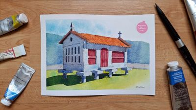Watercolour painting of a grey, stone hórreo with a red wooden door and orange, tiled roof. It sits on green grass with mountain in the distance. 
