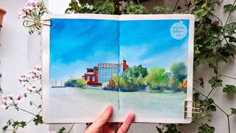 Watercolour sketch by Emma Bolton of the Brisbane Powerhouse surrounded by lush greenery on the Brisbane river under a turquoise sky. 
