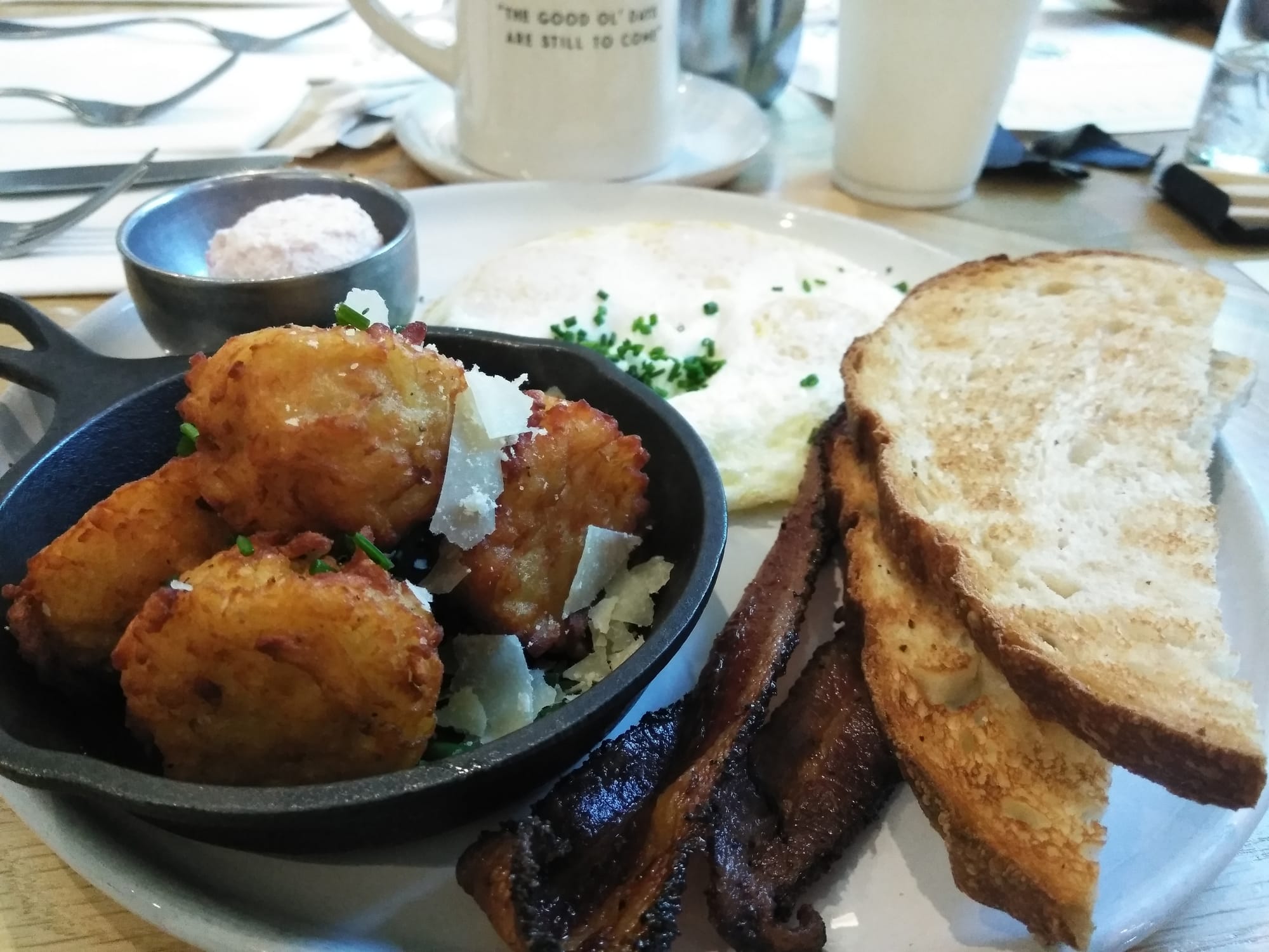A plate at Magnolia Table in Waco with eggs, bacon and toast