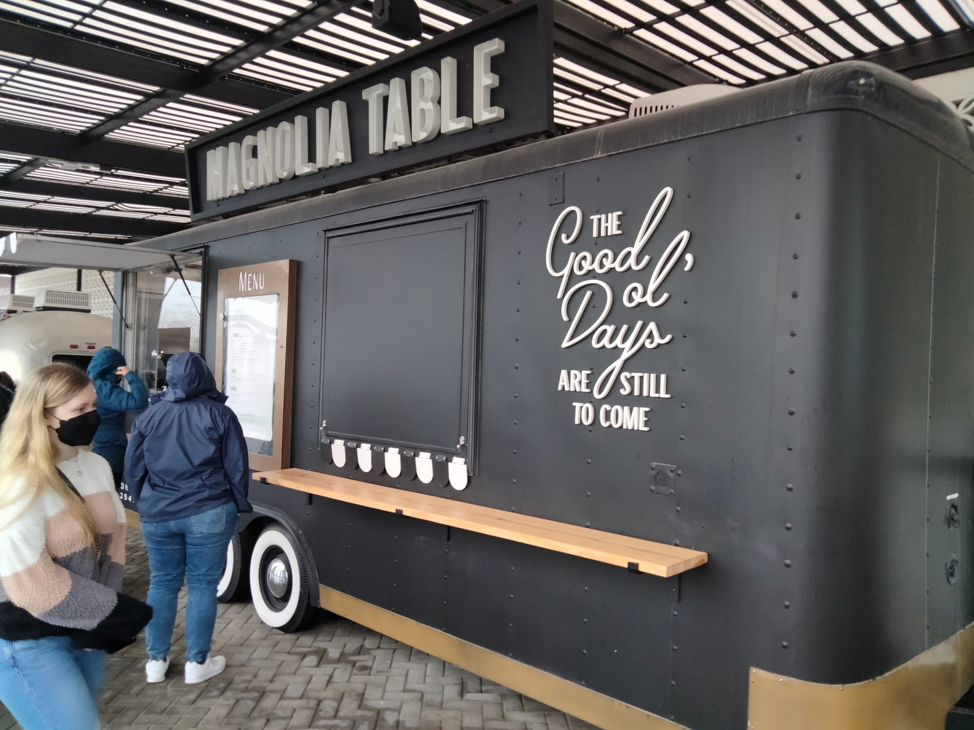 People standing in line at the Magnolia Table food truck at Magnolia at The Silos in Waco, TX
