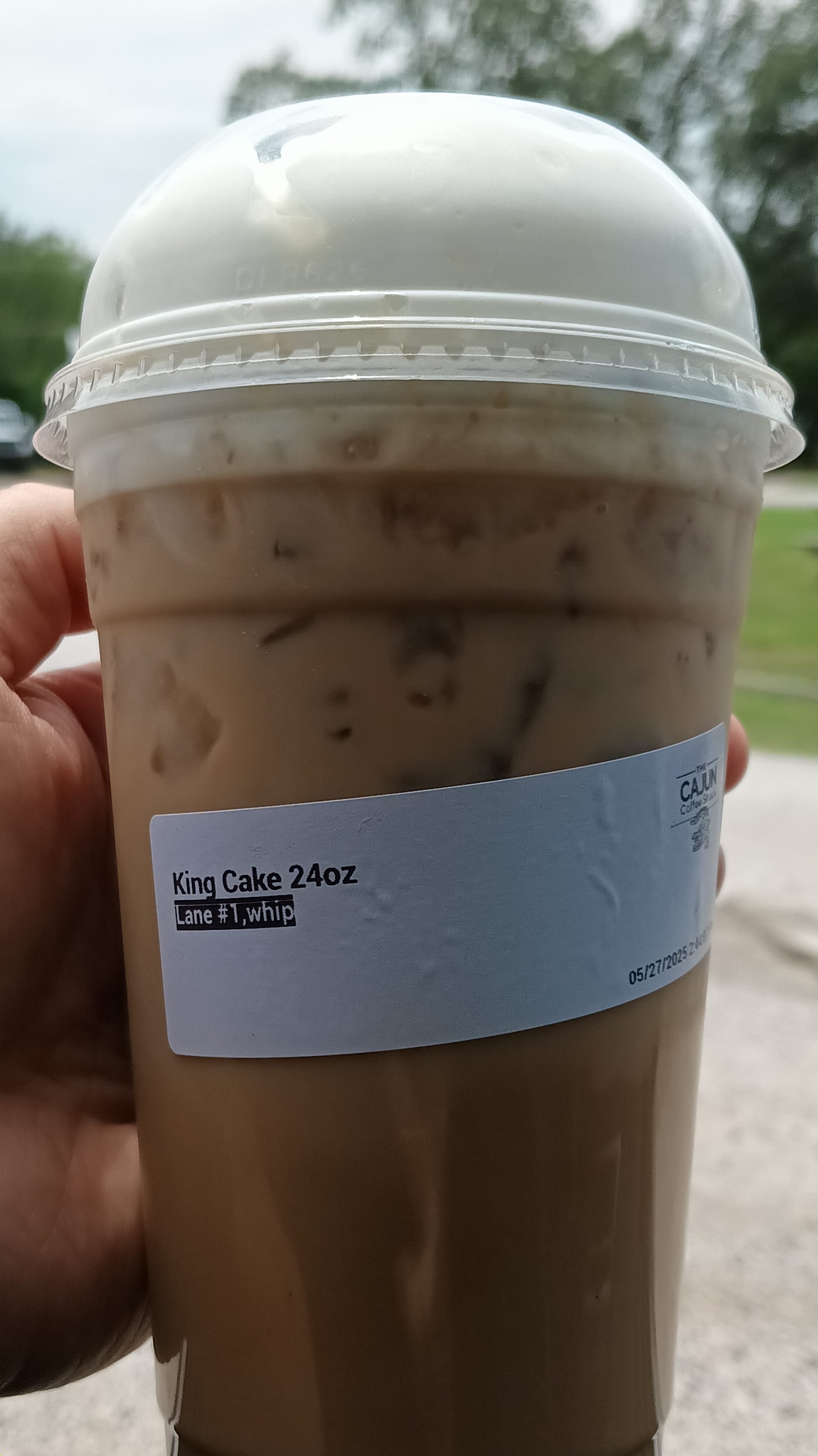 Cup of King Cake Latte 24oz with Whipped Cream from The Cajun Coffee Shack