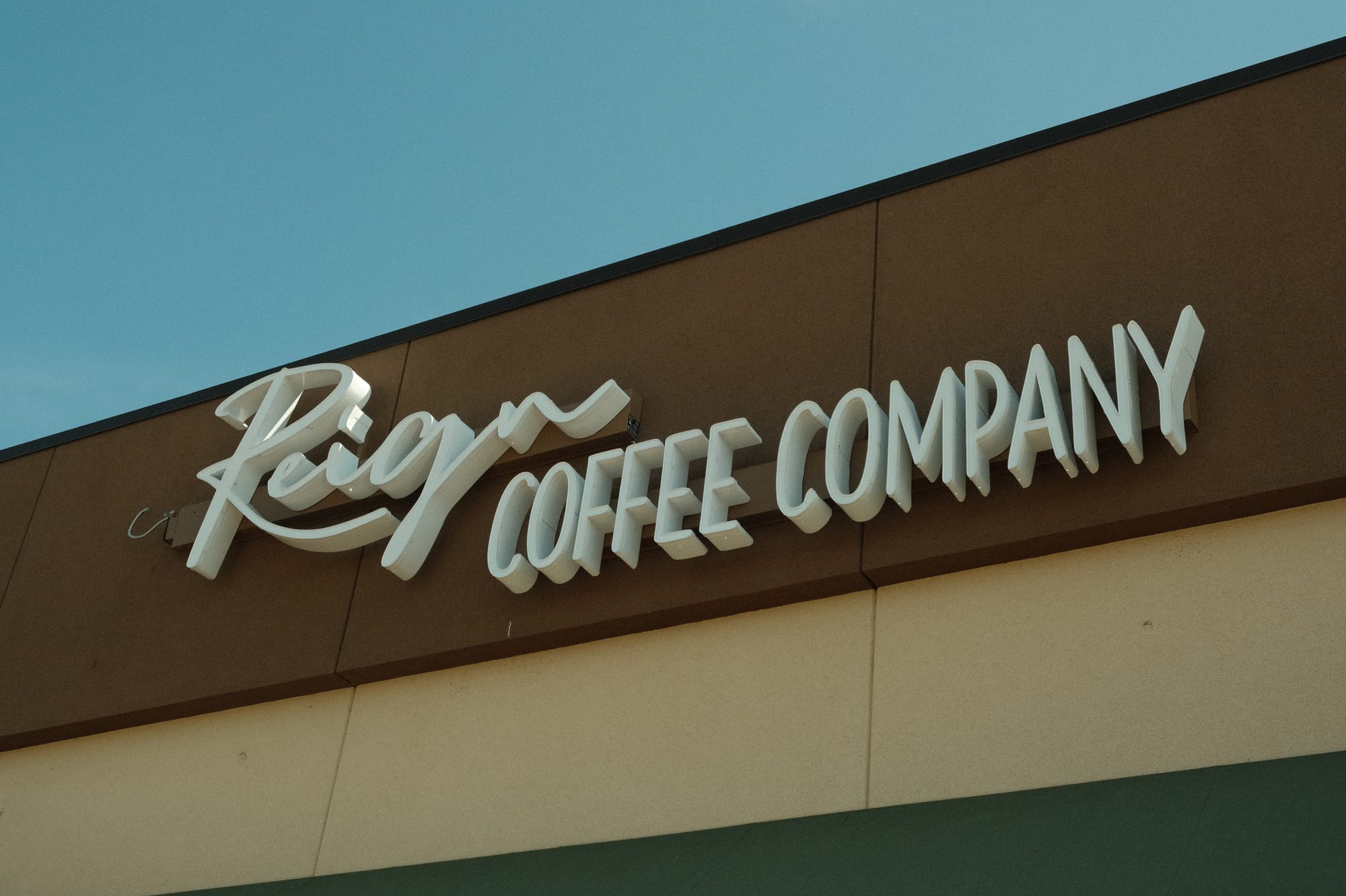 Reign Coffee Company sign at the top of their coffee shop