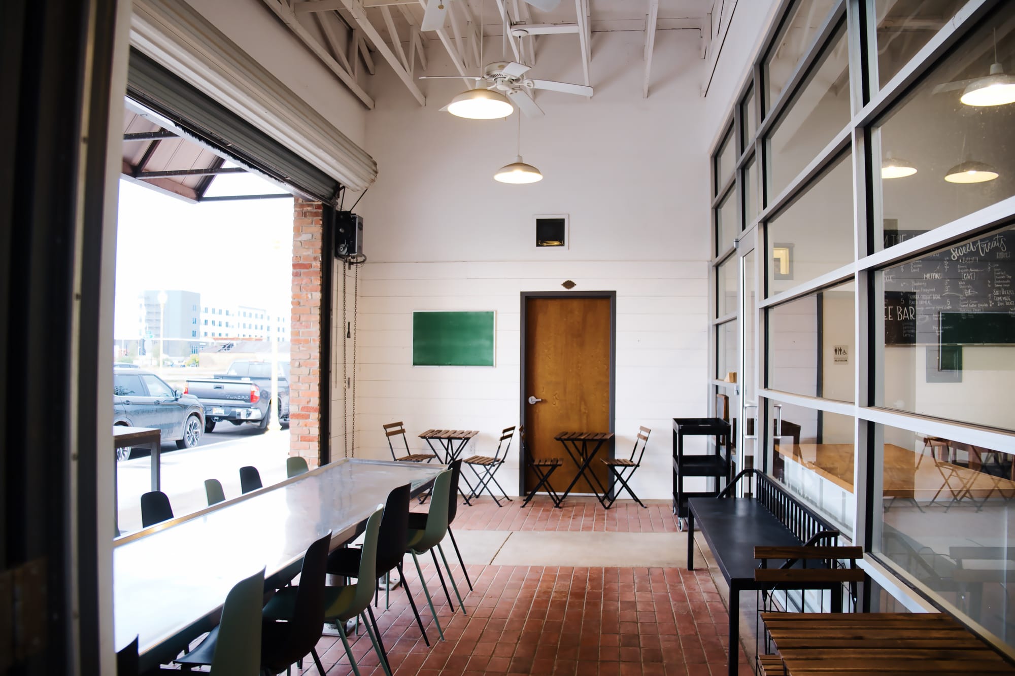 Street Dog Cafe's Covered Outdoor Patio with Metal Tables and Chairs