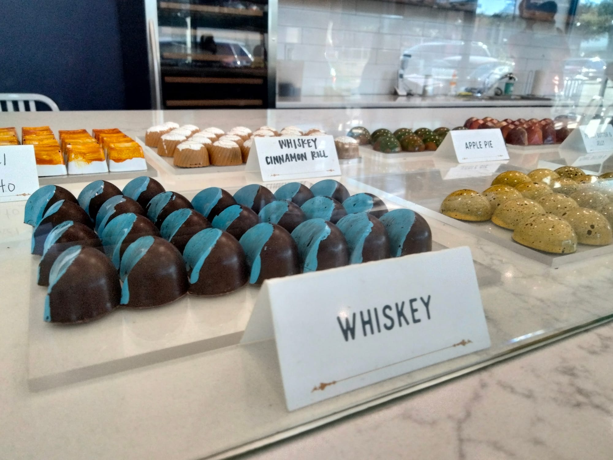 Rows of designer chocolates inside Splendid Oaks in Waco, TX