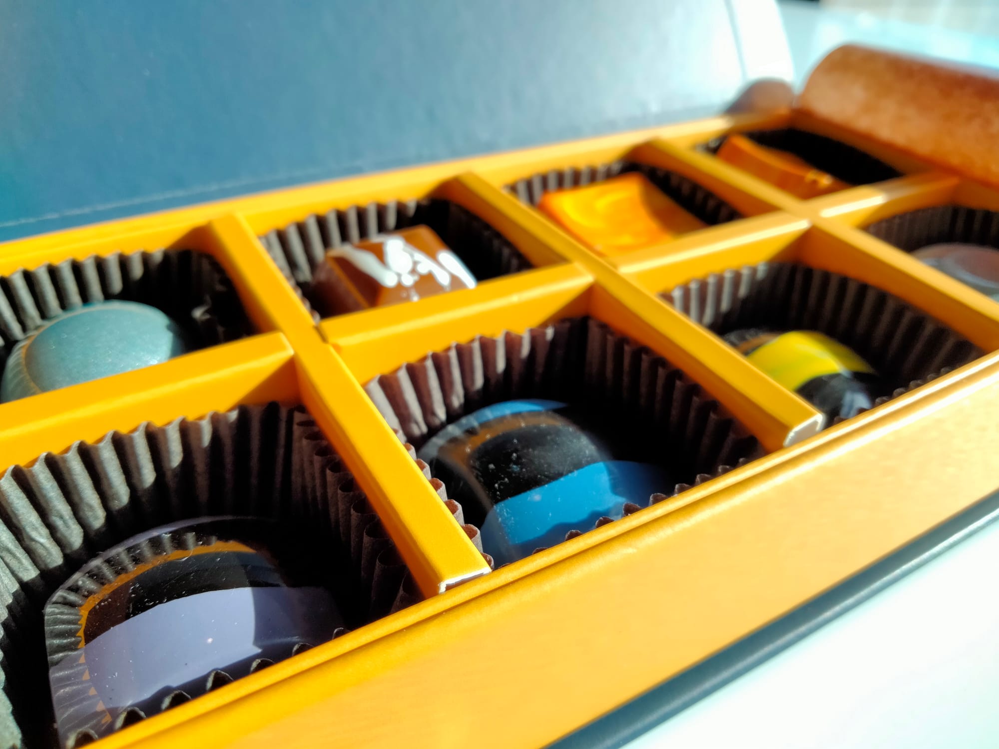 A box of designer chocolates in a box at Splendid Oaks, one of the best dessert places in Waco