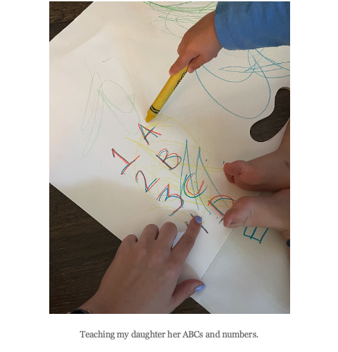 A picture of the author and her daughter writing ABCs.