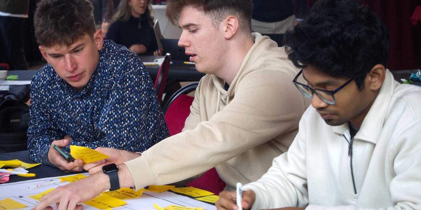 Participants working on the Business Model Canvas