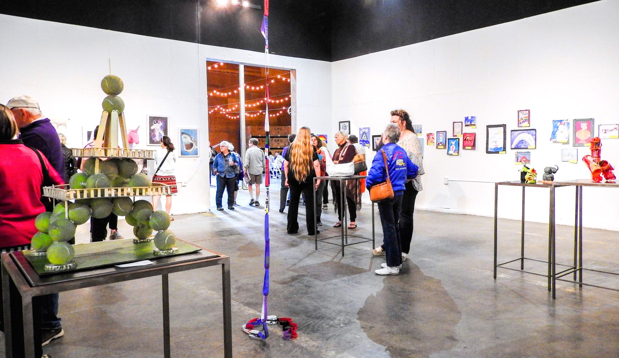 Photo of appreciative viewers at the Student Art Show