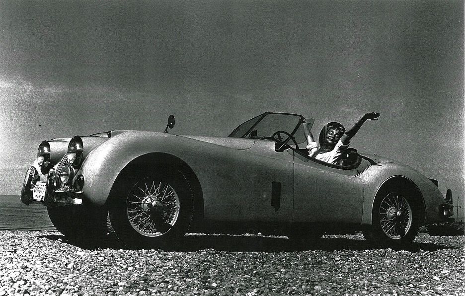 Photo of art supporter Betty Bowen in vintage convertible, by Mary Randlett