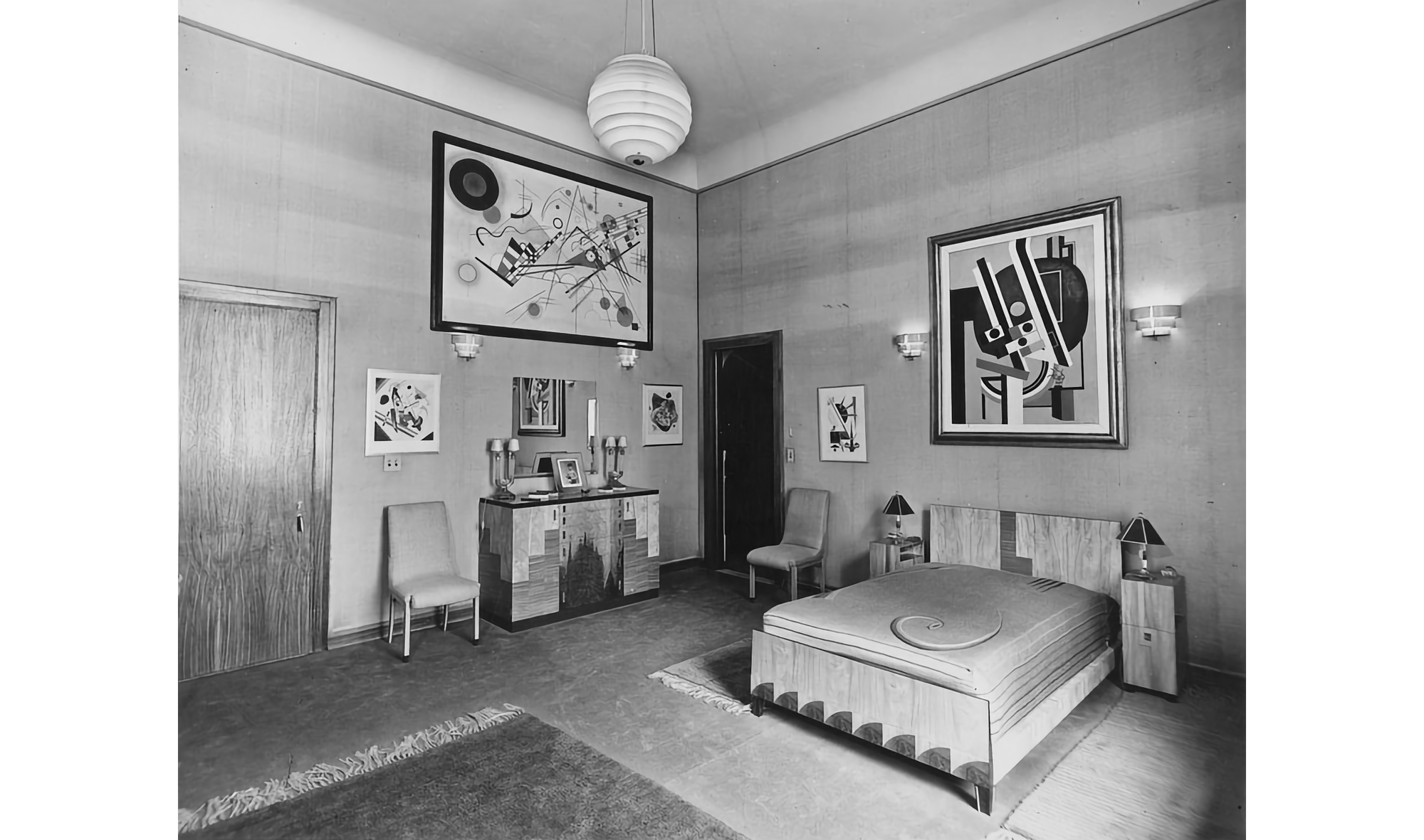 Photo of bedroom suite with art hanging on the walls