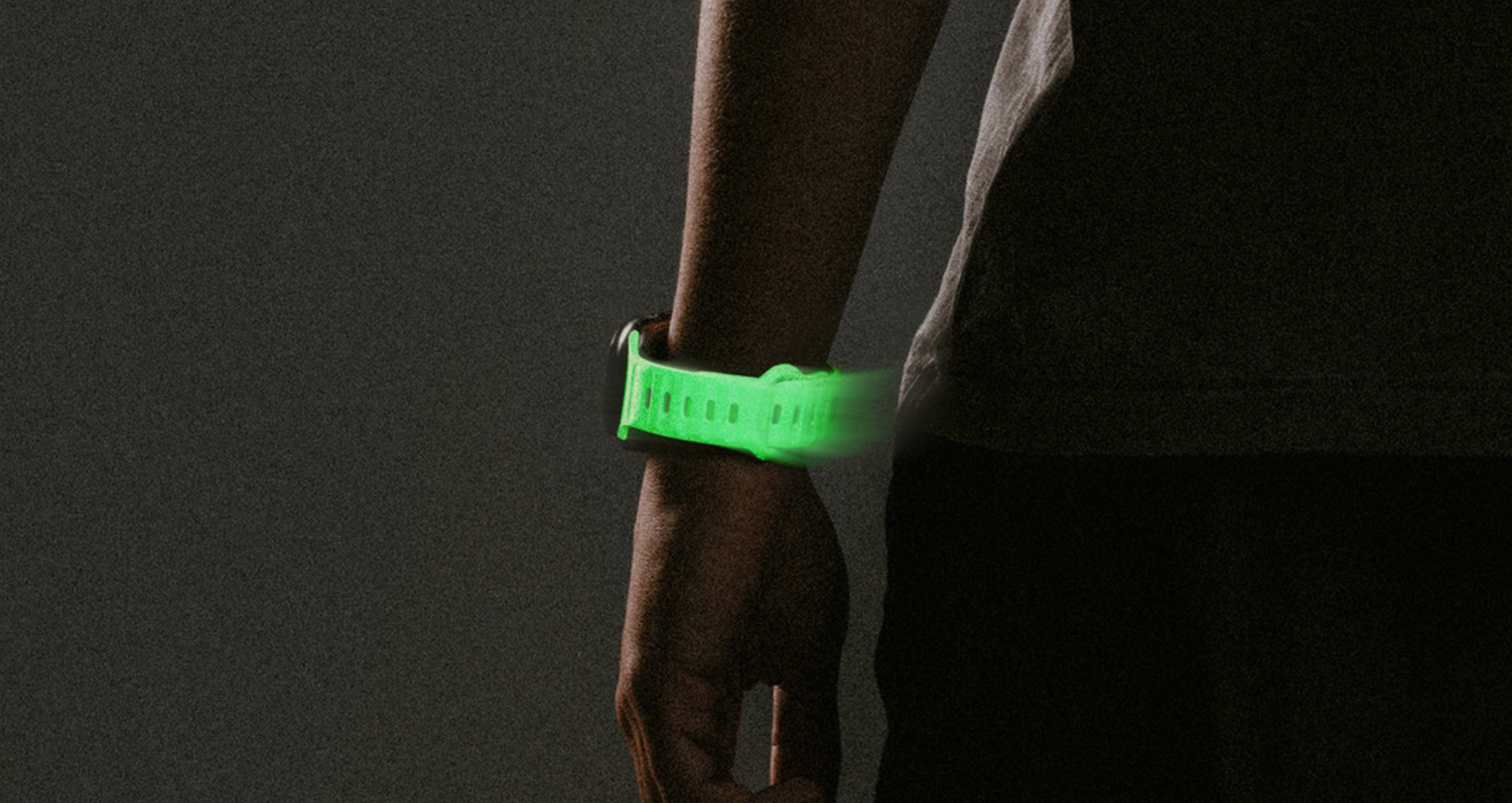 Glowing in the dark watch band on a person's wrist.