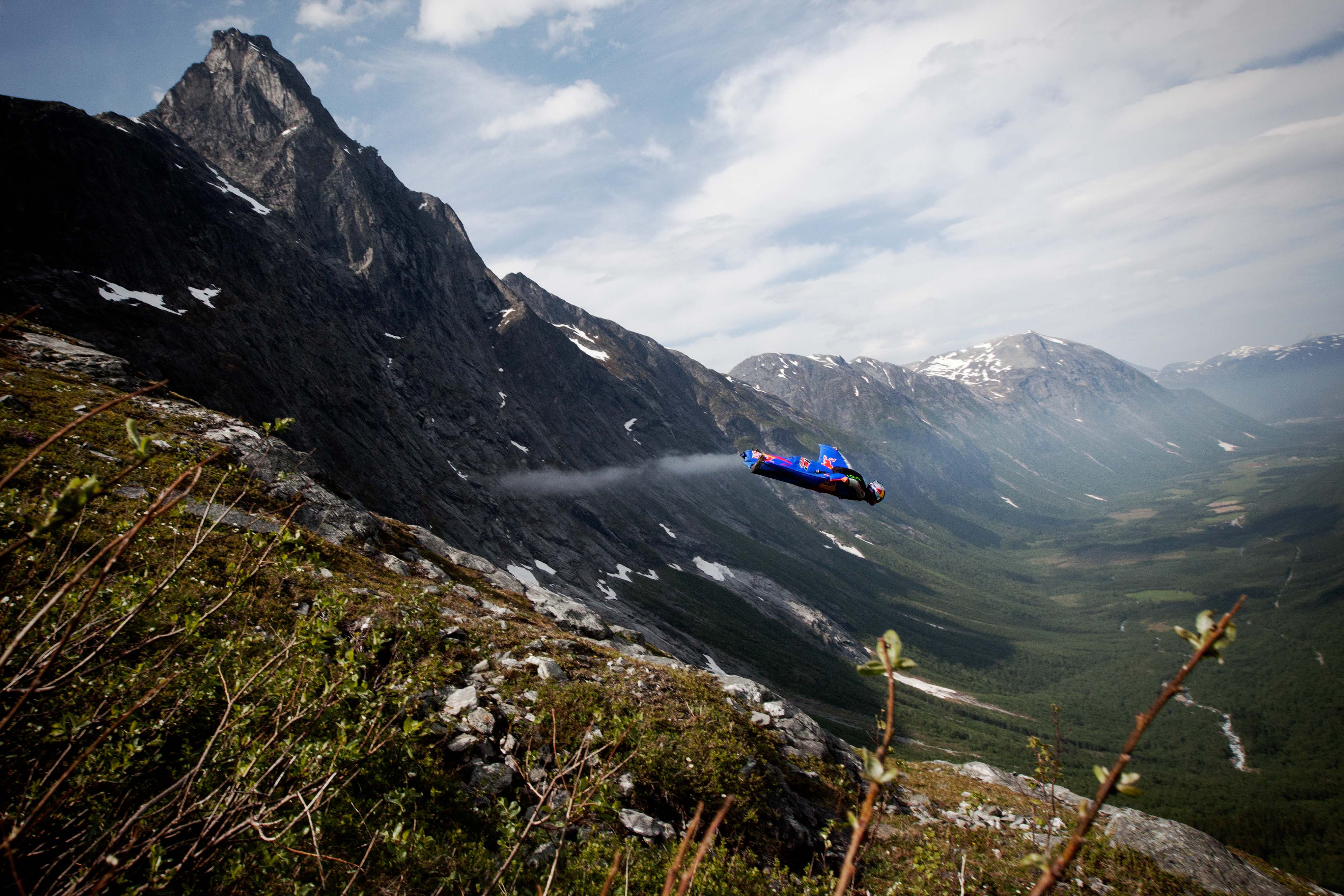 The usual, attainable glide ratio of a wingsuit is 2:5:1. For every meter dropped, two and a half meters are gained flying forward. Pictured here, an afternoon flight down Jokke's local spot in Bispen, Norway. Photo: Trond Teigen