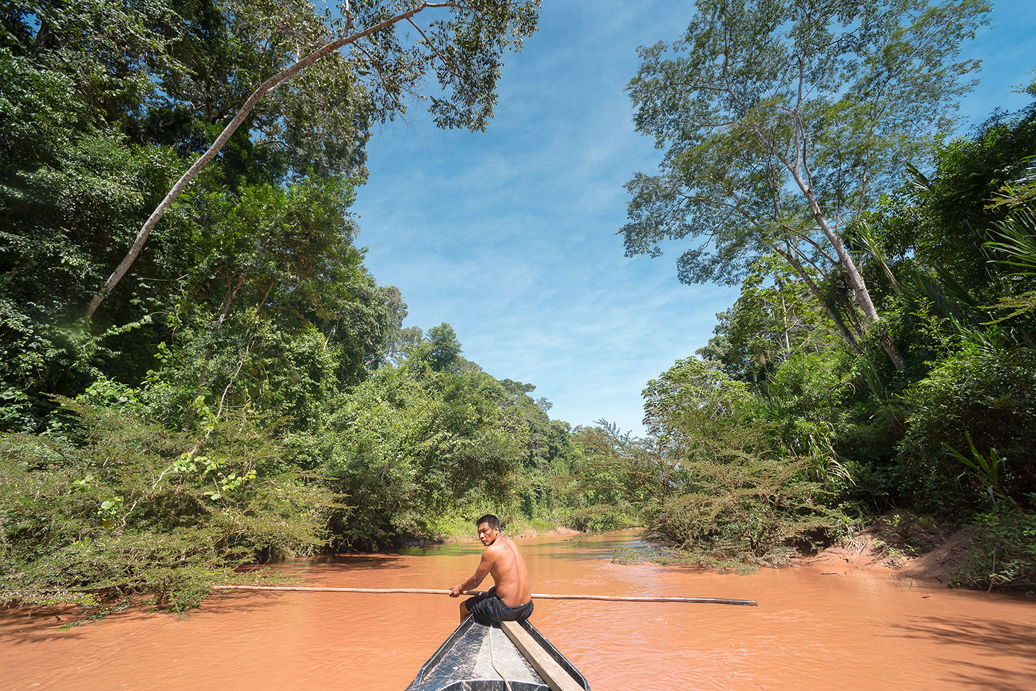 The crew's boat navigates the narrow waterway of the Yomibato River. Photo: Lina Collado