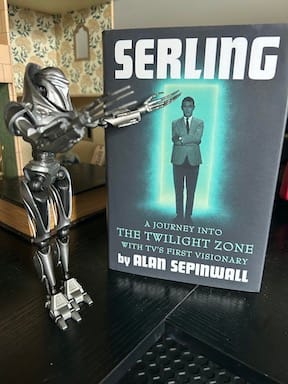 A Cylon Centurion figurine with the book Serling by Alan Sepinwall