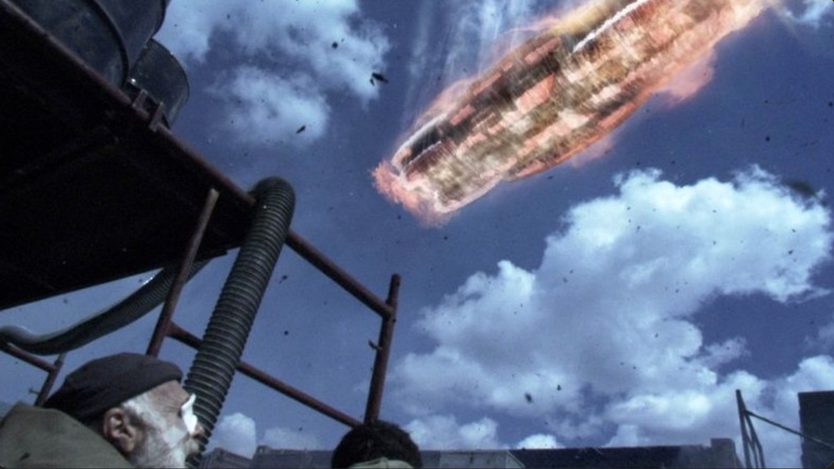 The Galactica jumps into the atmosphere on New Caprica as Tigh looks on. 