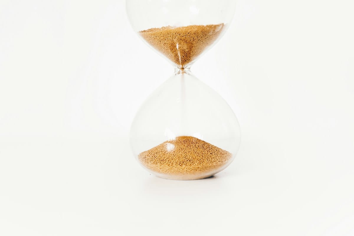 An hourglass with golden sand