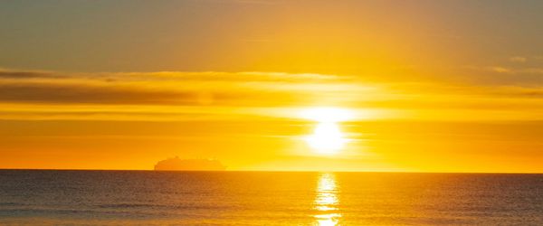 Golden sunrise over a calm sea