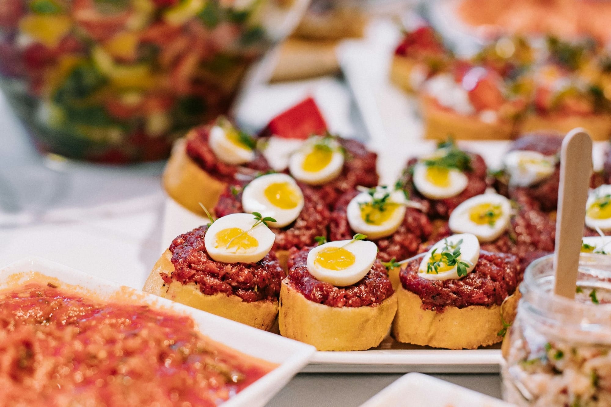 a table topped with lots of food covered in toppings