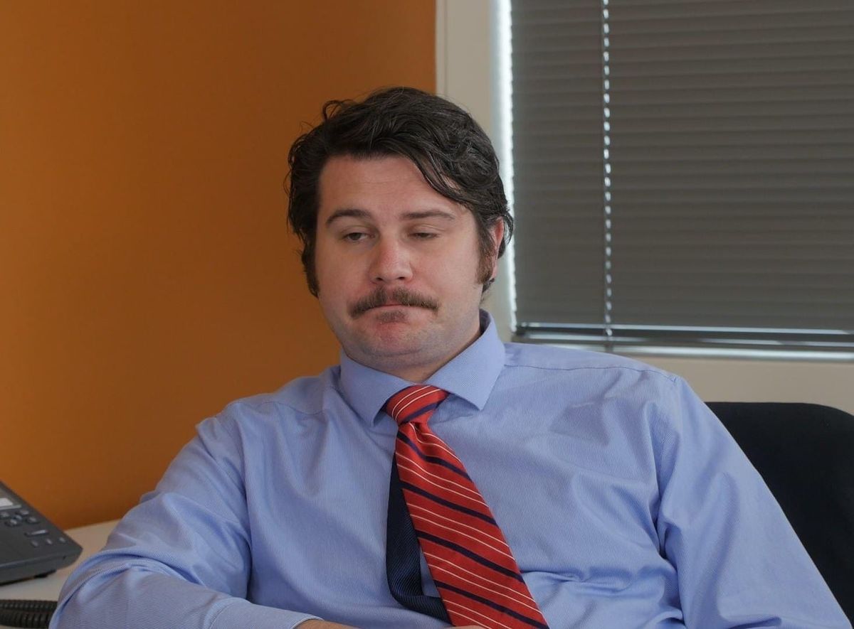 Me when I was an actor, wearing a blue shirt and tie while looking worn TF out.