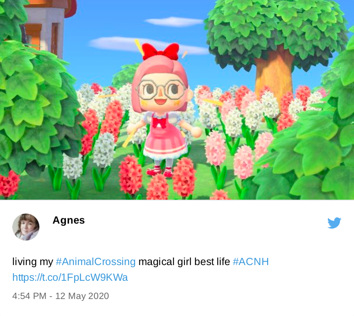 Tweet from me. "Living my Animal Crossing magical girl best life." My character has a big frilly pink dress and is covered in ribbons.