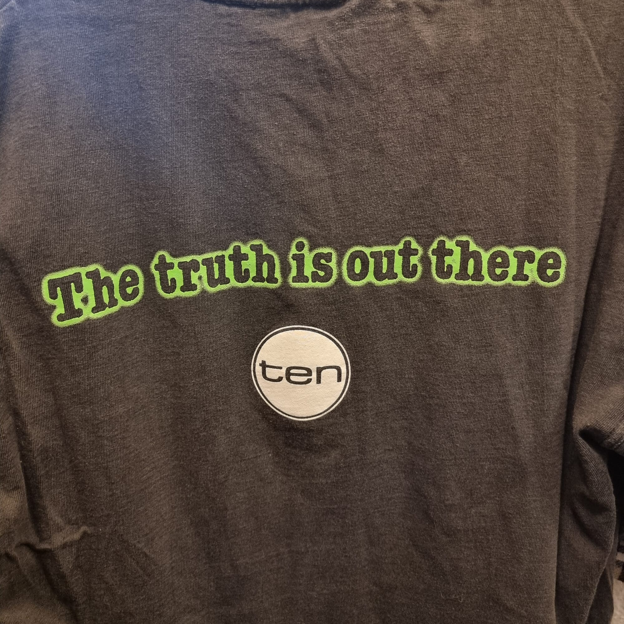 Back of the shirt says "The truth is out there" with the network 10 logo.