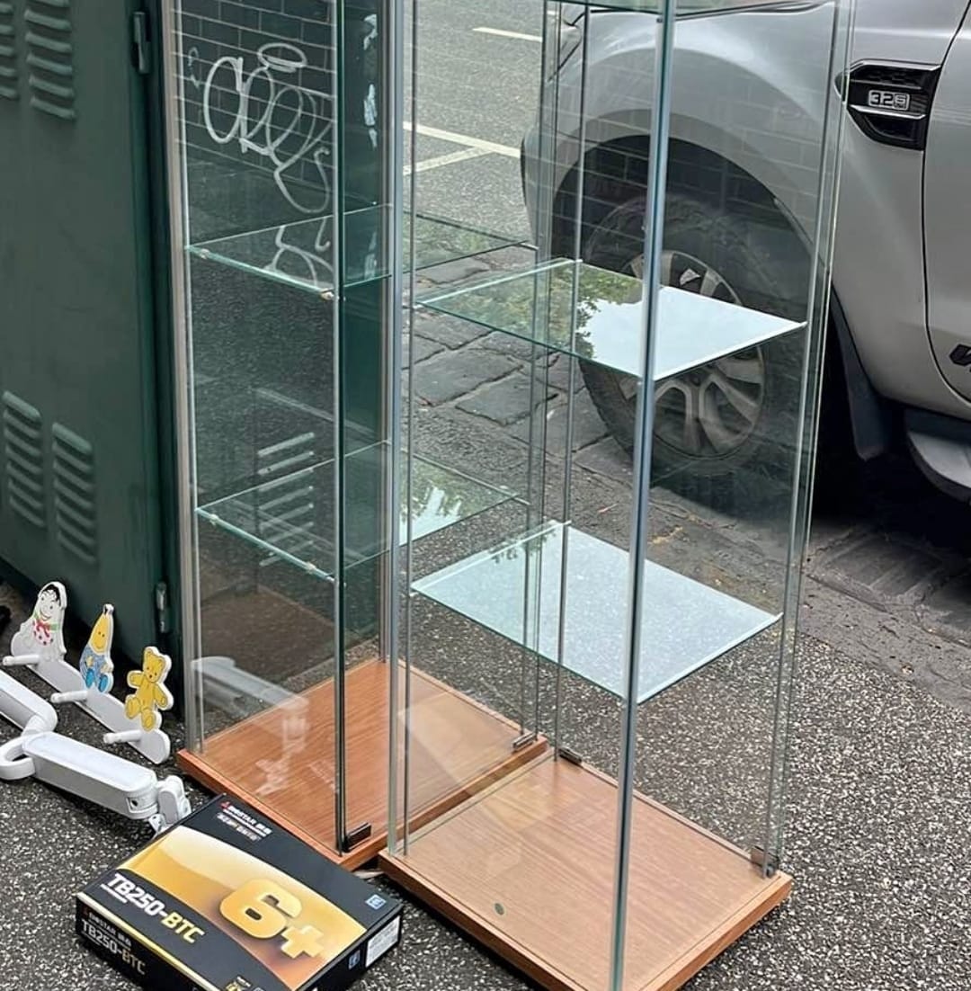 Two tall glass shelves and the ABC wall hooks on the ground.