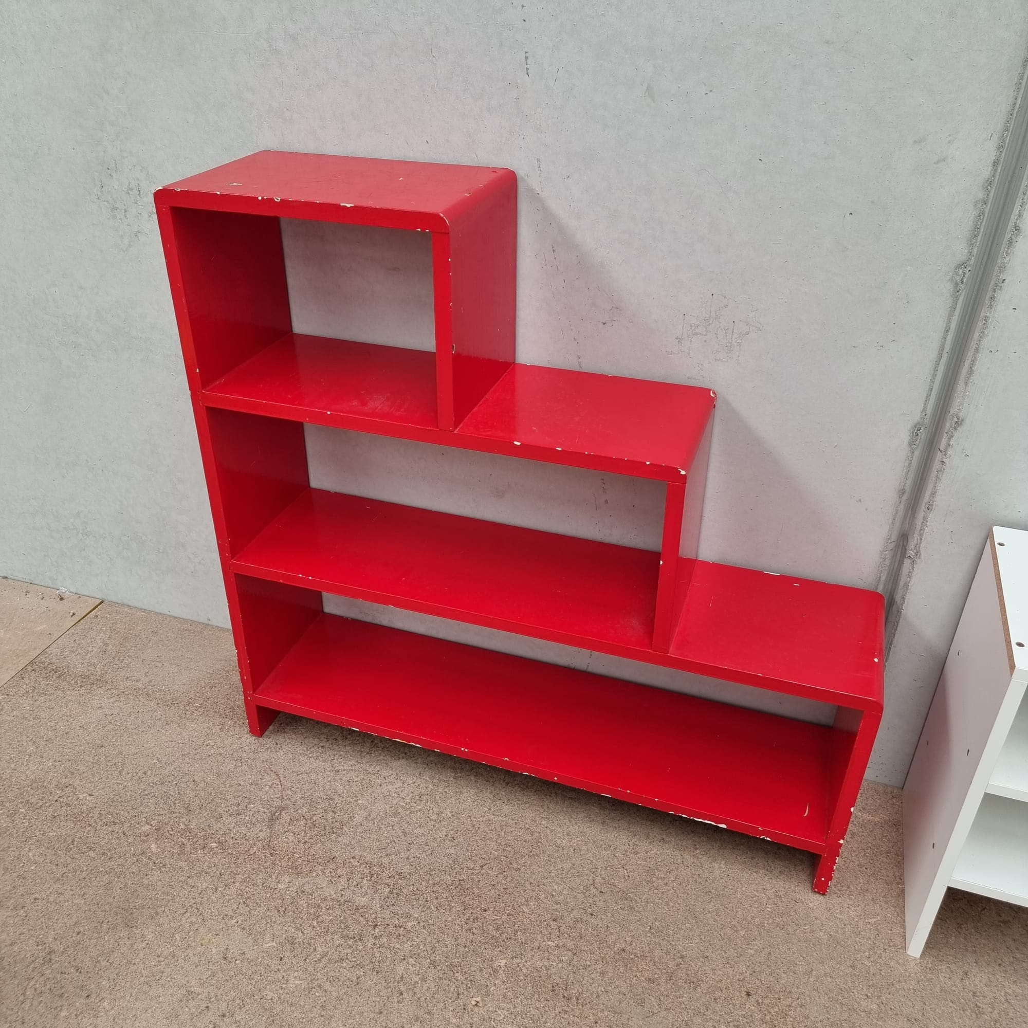 a bright red waterfall step shelf.