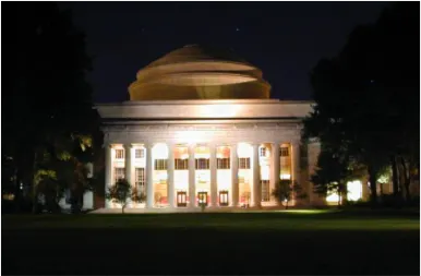 MIT Great Dome illuminated at night with campus buildings