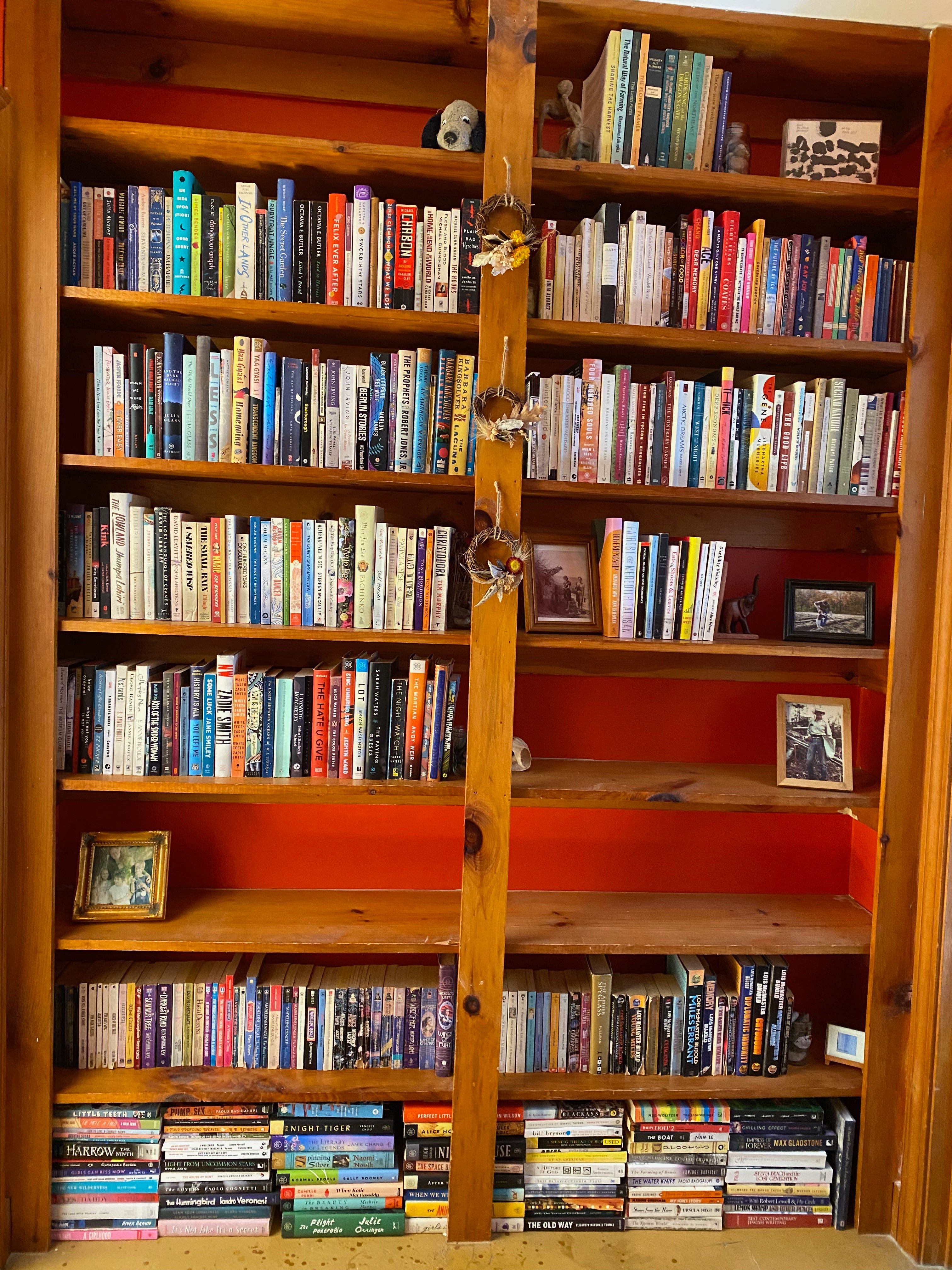 Two tall built-in bookshelves filled with books.