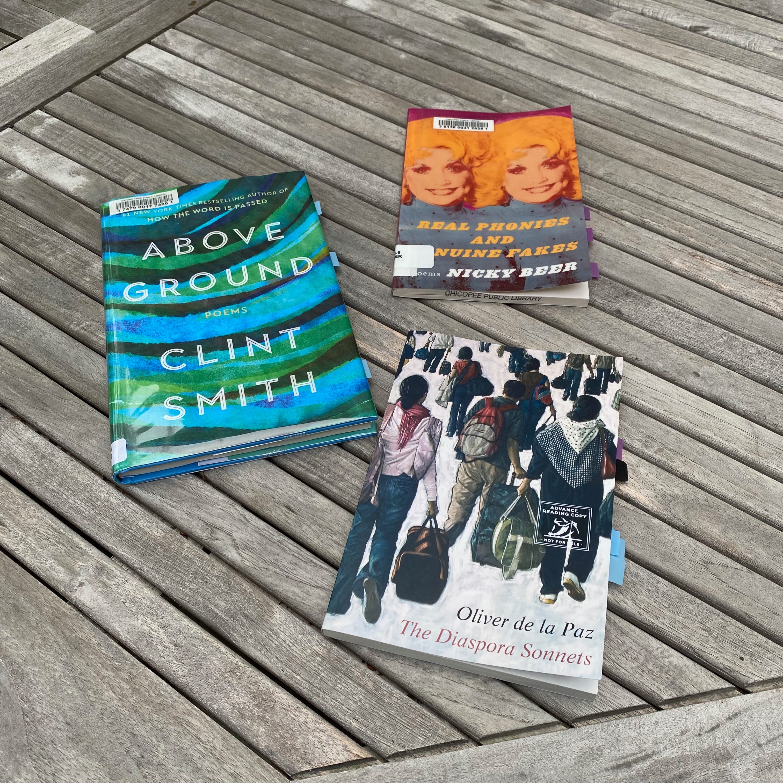 The three listed collections are laid out in a grey slated porch table.