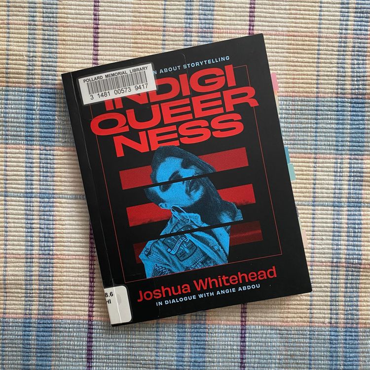 This book sits on a blue and white woven placemat.