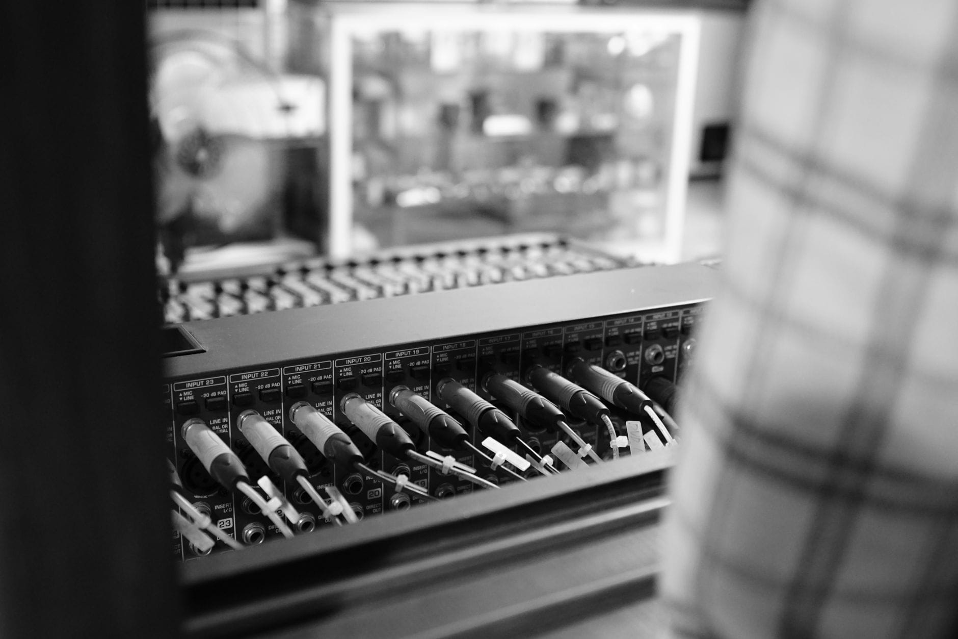 Close-up of audio patch cables in black and white