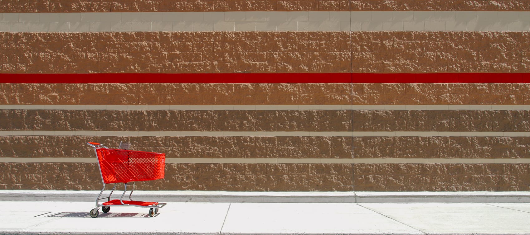 Red Shopping Cart Outside of Retail Store