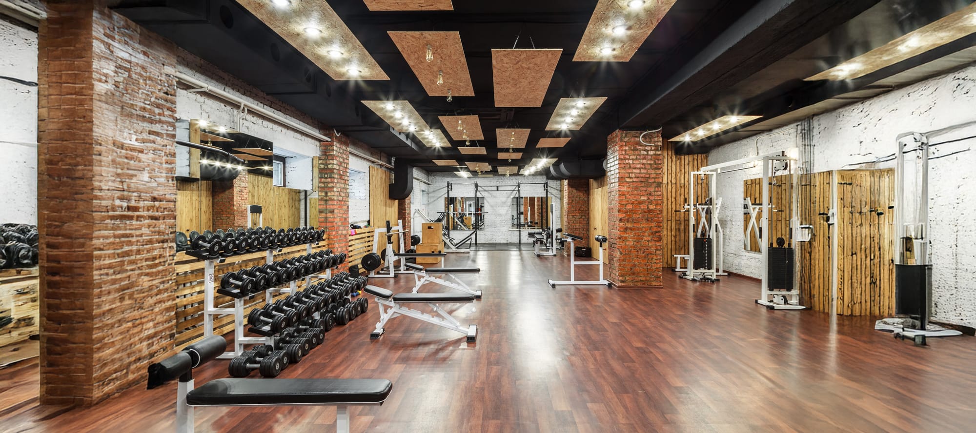 Interior of gym with free weights and weight equipment