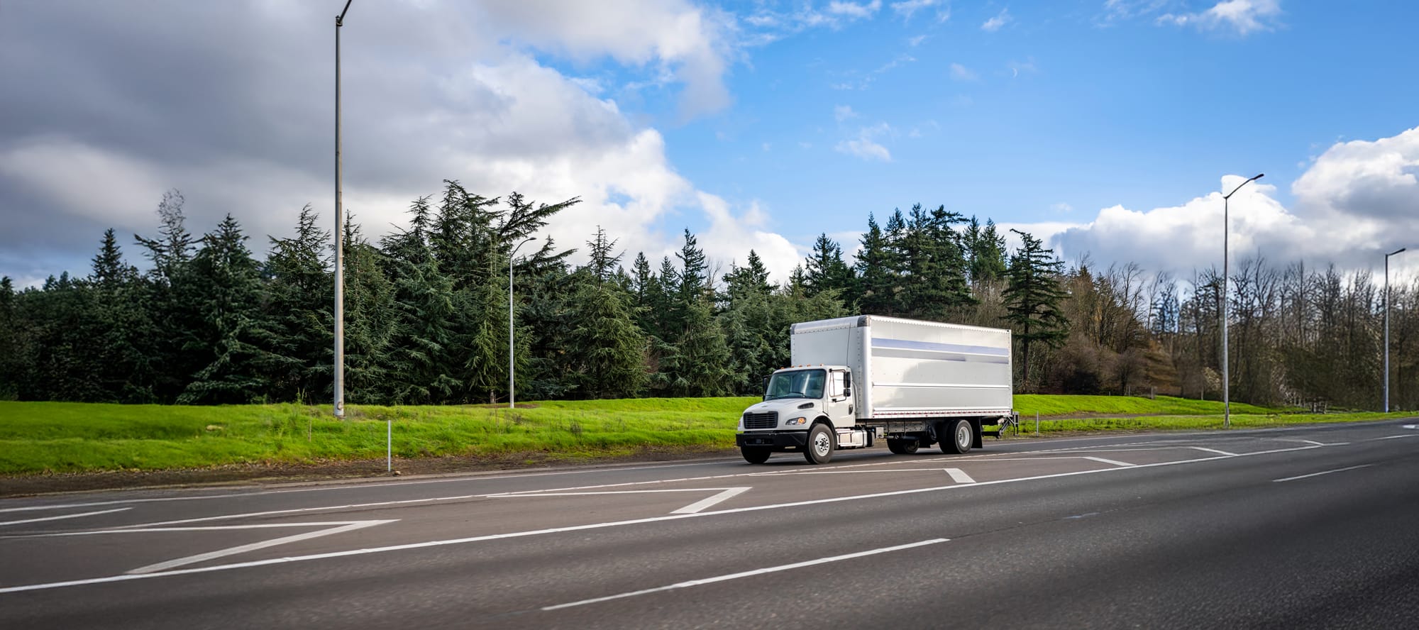 Box truck running on the highway entrance for delivery