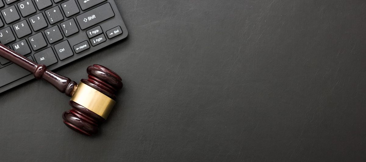 Gavel with computer keyboard. 
