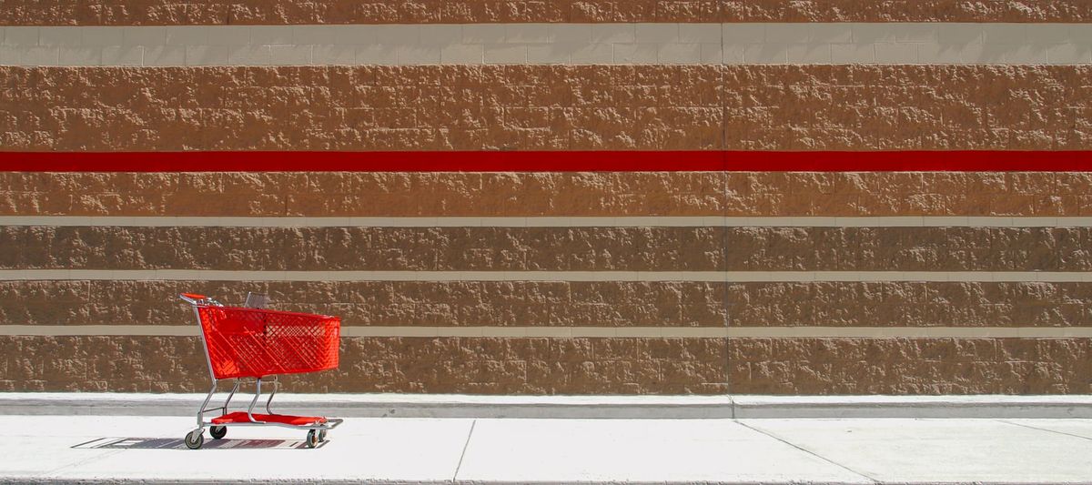 Red Shopping Cart Outside of Retail Store