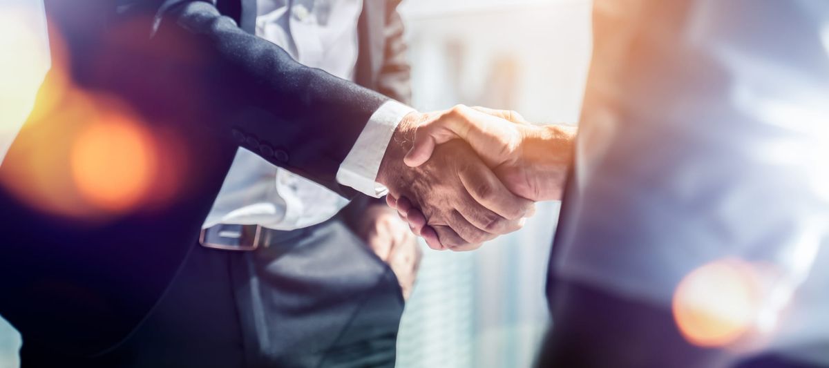 Two businessmen shaking hands.