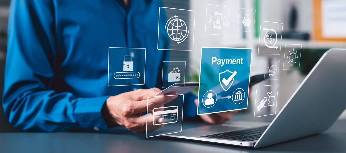 Person in a blue button down shirt making secure purchases online.